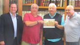 Photo presented to Holmes County commissioners in honor of two sheriffs named Weiss