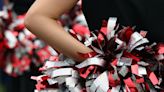 Job makes cheerleading coach relocate from Virginia to Florida only to not give her the position