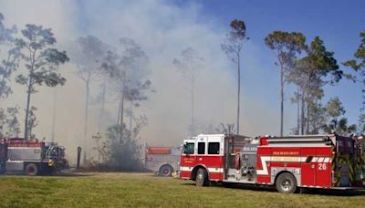 Firefighters battling to contain brush fire in Loxahatchee