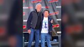 Michael J. Fox and Christopher Lloyd hug during Back to the Future reunion