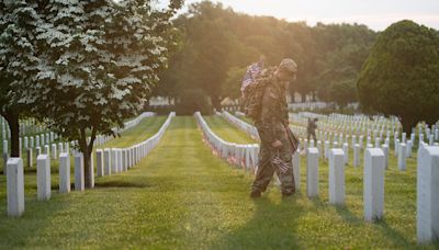 US Army soldiers place flags on Arlington National Cemetery gravesites in annual tradition