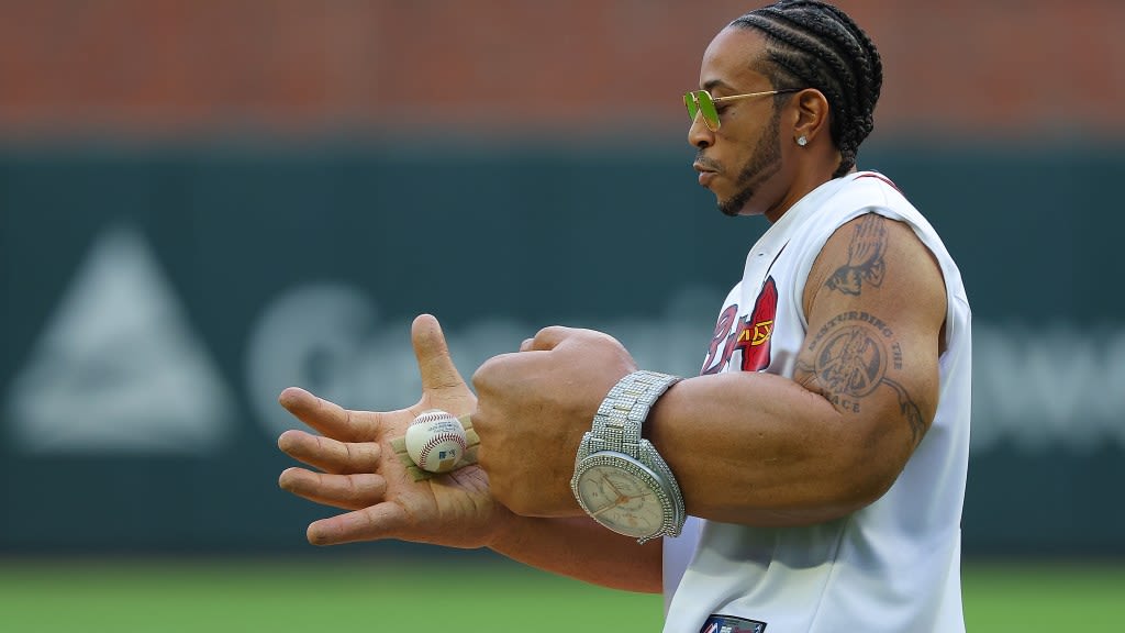 Ludacris looked so ludicrous with giant fake arms to throw the first pitch at a Braves game