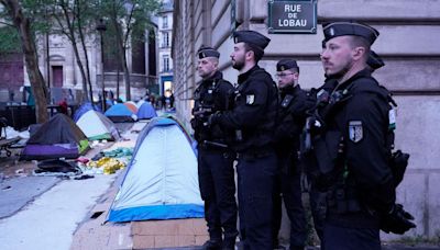 As Olympics near, Paris police clear 100 migrants from camp near City Hall