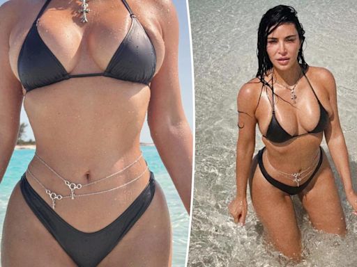 Kim Kardashian shows off curves in bikini and body chains: ‘Built like a trophy’