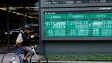 Japanese shares end higher on Wall Street gains, financials weigh