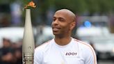 France manager Thierry Henry carries Olympic torch through Paris