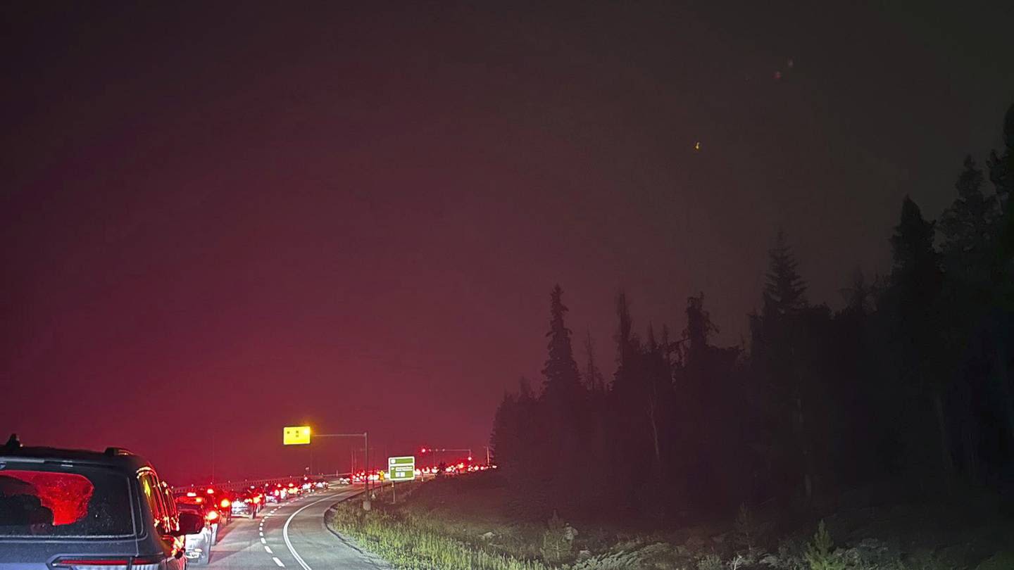 Wildfire reaches town in the Canadian Rockies' largest national park as attempt to reroute it fails