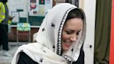 Kate Middleton echoes Queen's respectful style with sheer headscarf and modest black dress for Muslim centre visit
