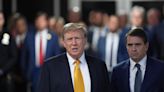 ...Trump with his lawyer Todd Blanche (R) speaks to the media as he arrives for his trial for allegedly covering up hush money payments at Manhattan Criminal Court on May 21, 2024 in New York City...