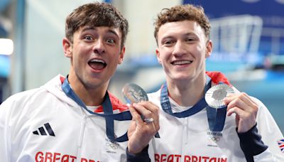 Tom Daley wins silver to complete set of Olympic medals — and is then soaked in fruit juice by son