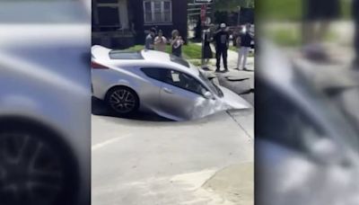 Sinkhole suddenly swallows car driving on Detroit side street