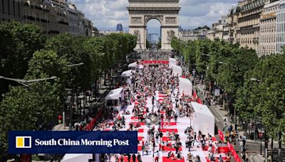 Paris’ Champs-Elysees turned into a mass picnic blanket for an unusual meal