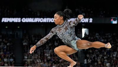 Simone Biles shakes off calf injury to dominate during Olympic gymnastics qualifying