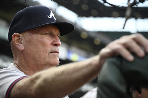 Braves manager Brian Snitker smiles 1 day after being hit below the belt by a foul ball - The Morning Sun