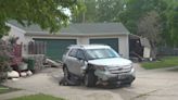 Extensive damage after SUV runs into shed, garage and deck