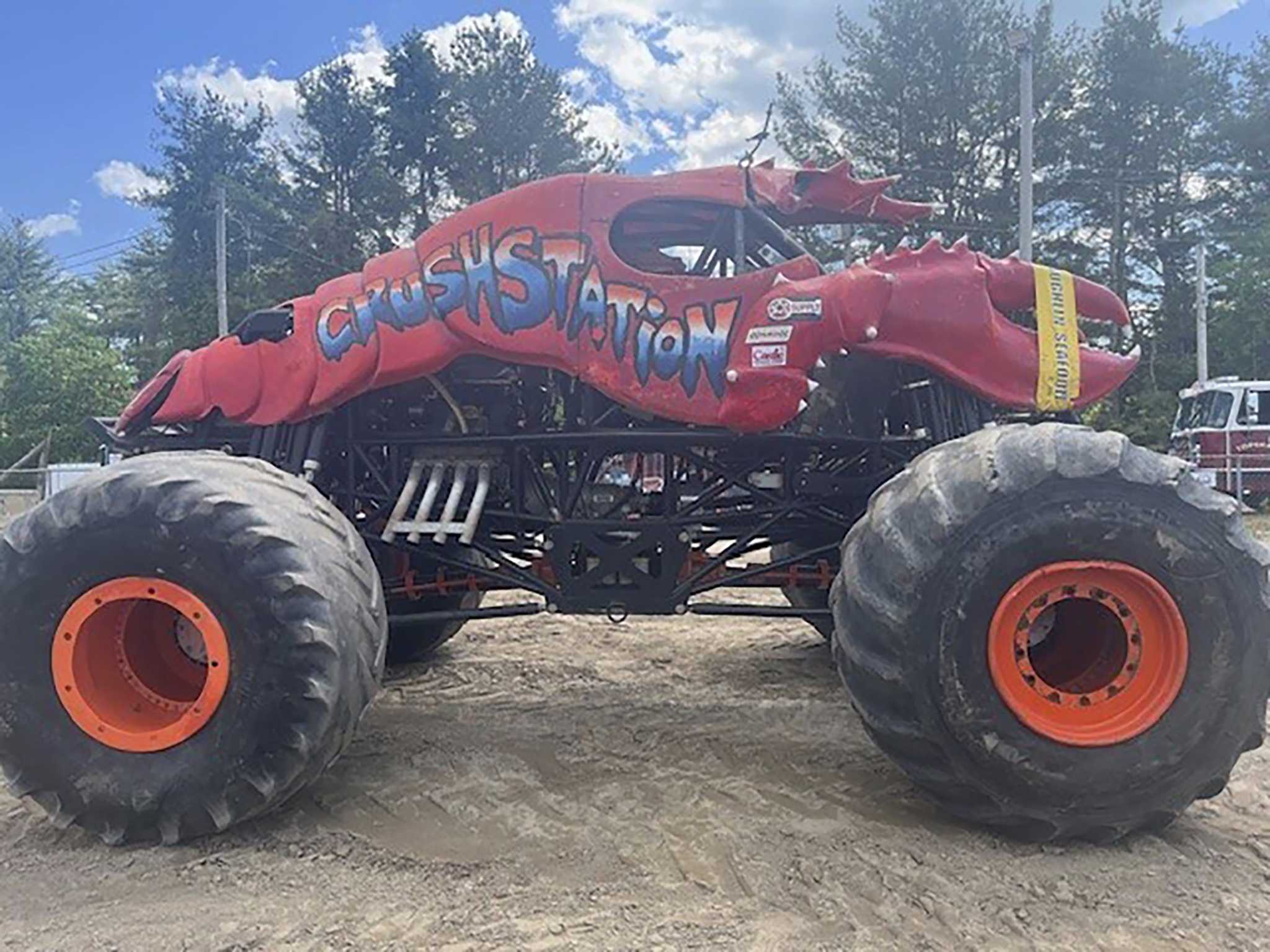 A monster truck clips a power line at a Maine show, toppling utility poles in spectator area