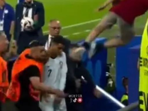 Cristiano Ronaldo narrowly avoids being two-footed in the face by fan