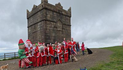 Why a group of 25 Santas climbed up Rivington Pike 6 months before Christmas