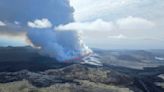 An Iceland volcano spews red streams of lava toward an evacuated town