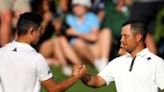 Americans Collin Morikawa, left, and Xander Schauffele shake hands on the 18th green at Valhalla after sharing the lead through three rounds of the PGA Championship