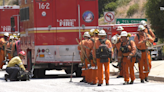 Firefighters knock down brushfire off 101 Freeway in Hollywood Hills