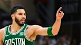 Jayson Tatum of the Boston Celtics reacts after scoring a basket against the Cleveland Cavaliers during the third quarter in Game Three of the Eastern Conference ...