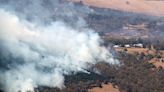 Thousands told to flee homes in Australia amid heat spike, bushfire threat
