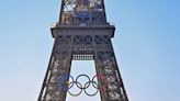 Paris Olympics organizers unveil a display of the five Olympic rings mounted on the Eiffel Tower