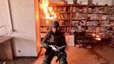 Fact Check: What To Know About Photo Allegedly Showing Israeli Soldier Posing in Front of Burning Books at University in Gaza