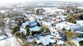 More than 100 flood warnings in place after UK shivers through snowy and icy morning