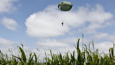 Mass parachute jump over Normandy kicks off D-Day commemorations - but Putin is not invited