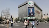 Iranians vote in run-off presidential election amid widespread apathy