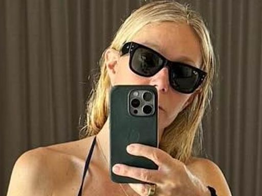 Gwyneth Paltrow, 51, bares her toned tummy in blue bikini top