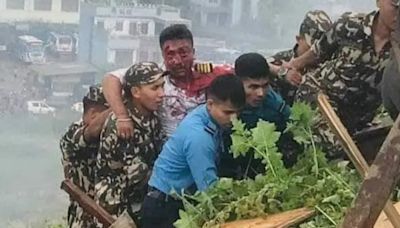 Moment sole survivor Nepal pilot is pulled from plane wreckage after crash