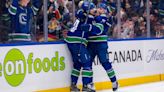 Canucks down Flames to clinch Pacific title