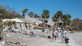 ‘We’re tired, dirty and hungry’: Hurricane Ian survivors leave Fort Myers Beach on foot