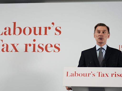 Hunt declines to guarantee tax cuts but insists burden will go down under Tories