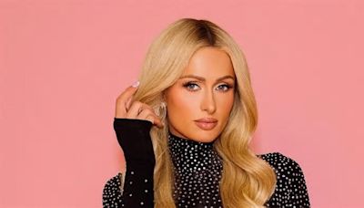 Paris Hilton introduces daughter London! Star shares adorable first snaps of her baby girl five months after her birth as she poses for family snaps with Carter Reum and son ...