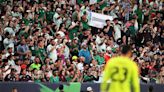 Fans rush Empower Field during Mexico-Uruguay soccer match, 6 arrested for trespassing