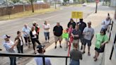 Adrian residents march from Monument Park to Crimson Holdings in protest of egg smell