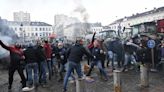 Protesting farmers hurl eggs and clog streets with tractors as EU summit begins