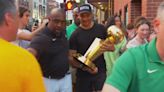 Celtics coach Joe Mazzulla takes championship trophy around North End