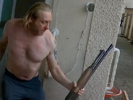 Weapons nut charges out of his home semi-naked carrying a SHOTGUN