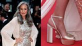Andie Macdowell Keeps the Sky-High Trend Going in Gold Satin Prada Platform Sandals at Cannes Film Festival