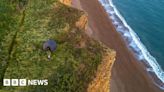 Tent seen near Jurassic Coast cliff edge despite rockfall warnings