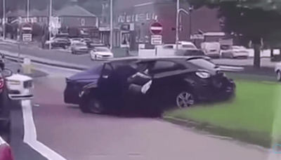 Horrifying moment cop is dragged under car as driver tries to speed off