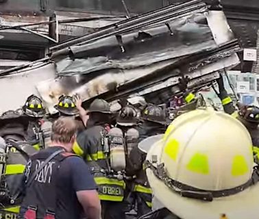 Shocking video shows metal shop awnings crash down on NYC firefighters, wounding 3