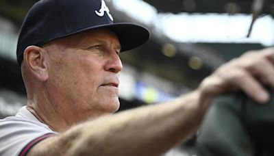 Braves manager Brian Snitker smiles 1 day after being hit below the belt by a foul ball