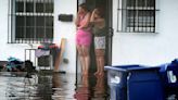 Stalled cars in flooded streets left South Florida looking like a scene from a zombie movie