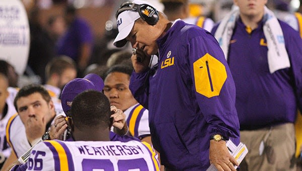 Les Miles sues LSU to get vacated wins back - The Vicksburg Post